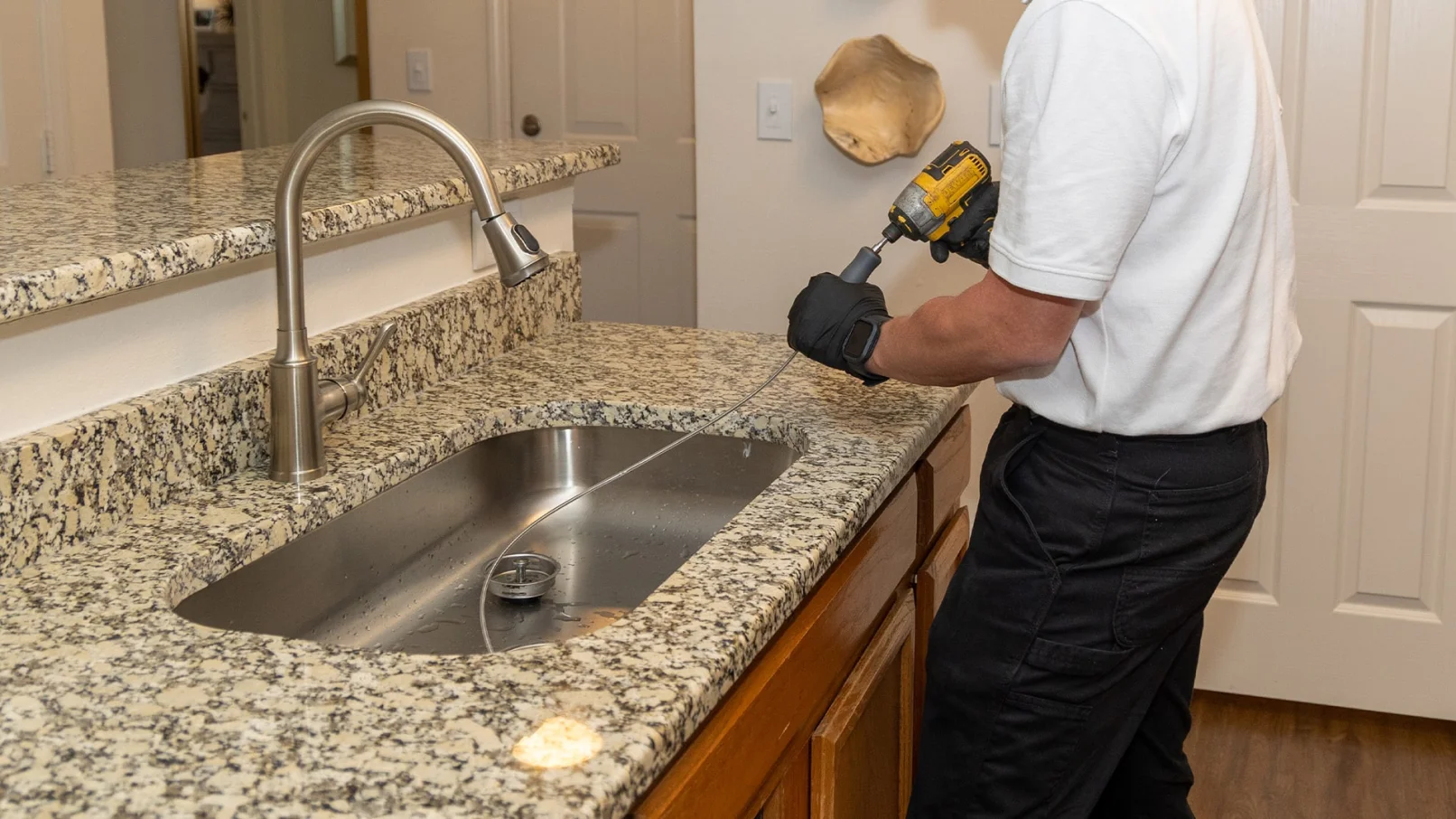a man standing on a kitchen counter